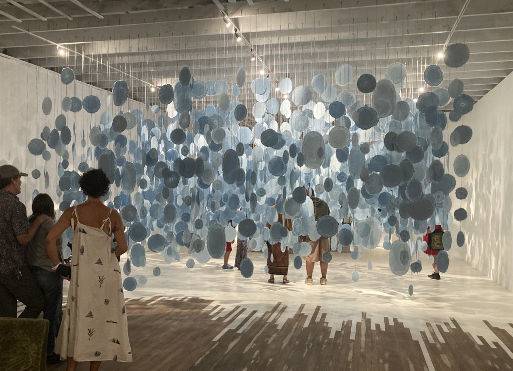 Melissa Haviland, "of fog", 2000+ handmade paper pieces from indigo dyed cloth with watermarks, ribbon, 20’ x 16’ x 14’t, 2024